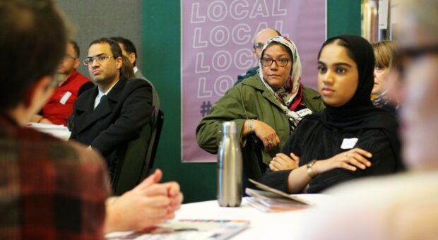 People participating in an event about local public services.