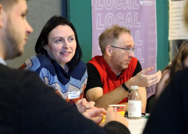 A photo of public sector workers participating in a local event.