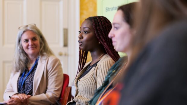 A photo of people discussing policymaking at an event