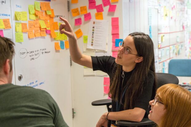 A photo of officials planning delivery of a policy or service.