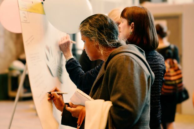 A photo of people participating in an event about public services.