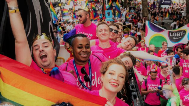 A photo of an civil servants celebrating at a pride event.