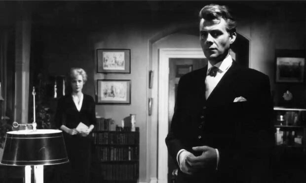 A photo of Dirk Bogarde and Sylvia Syms in Victim.