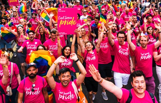 A photo of civil servants celebrating at a pride event.