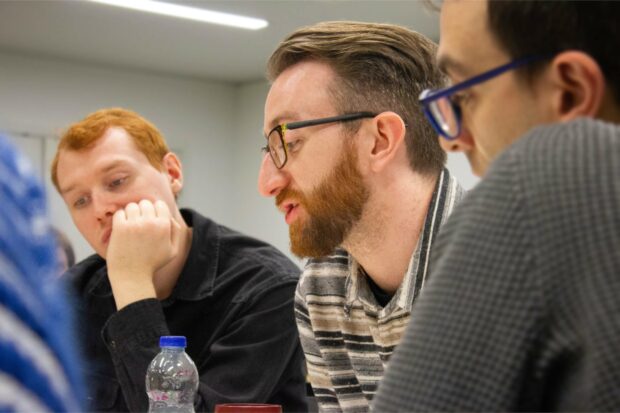 A photo of people at an event about public services.