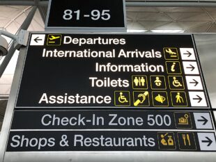 A photo of a sign in an airport.