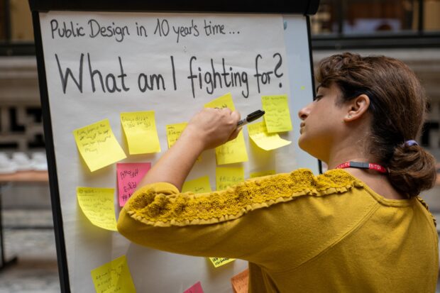 A person participating in an event about the design of public policies and services.