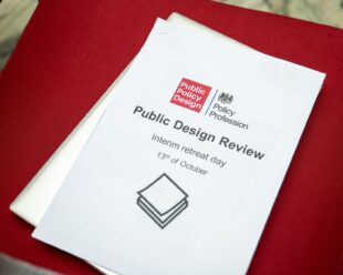 A photo of the a document that reads 'Public Design Review: interim retreat day'