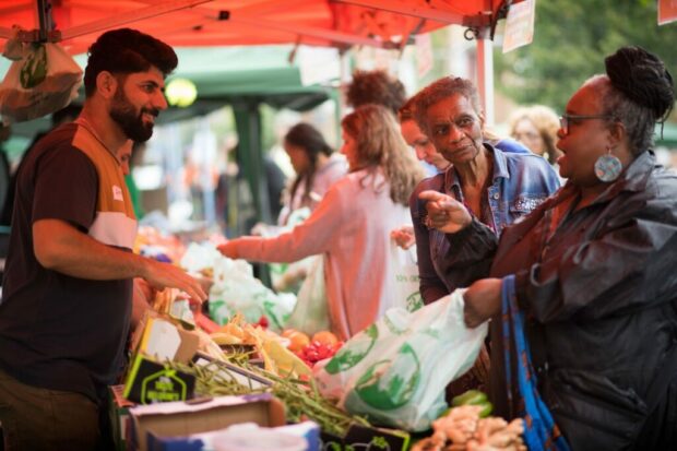 People shopping in a local market in Southwark.