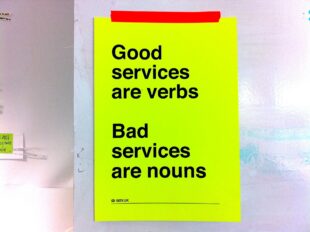 A photo of a sign that says, 'Good services are verbs, bad services are nouns'.