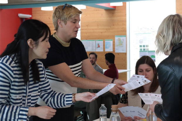 Workshop participants discussing ‘evidence cards’