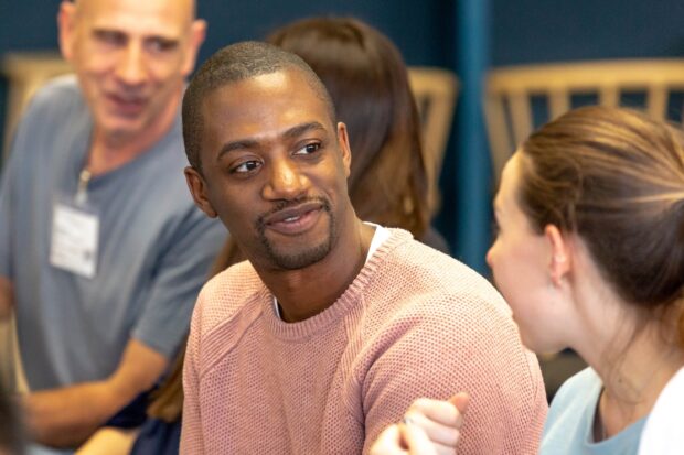 A photo of a person participating in an event about public services.