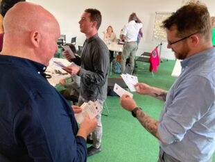 A photo of government officials participating in a workshop