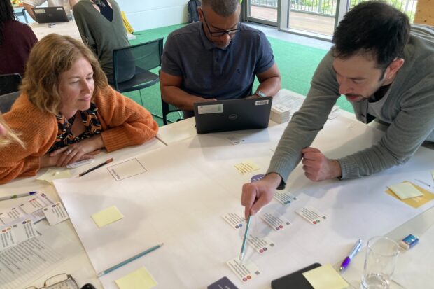 A photo of government officials participating in a workshop